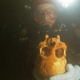 A cave diver holding a human skull in Chan Hol Cave.